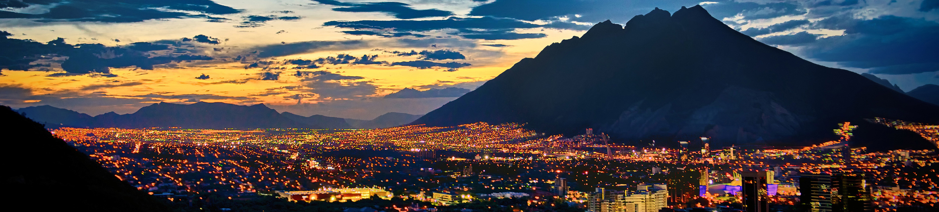 city scape with mountain in background