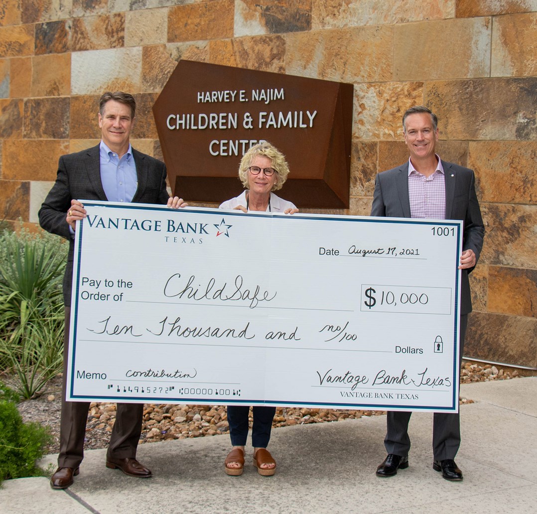 Vantage Bank donating money to a community charity