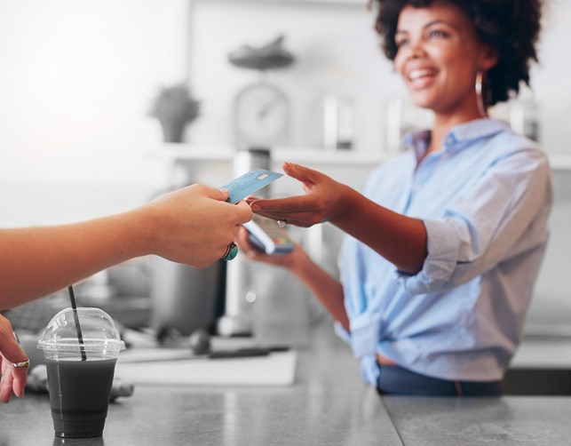 Customer swiping a credit card at a restaurant